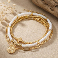 Bracelet Multi-Rangs Perles & Charm Cœur Doré — Style Romantique