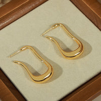 Boucles d'Oreilles Goutte Longue Dorée — Design Fluide Minimaliste