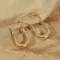 Boucles d'Oreilles Goutte Longue Dorée — Design Fluide Minimaliste