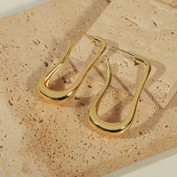 Boucles d'Oreilles Goutte Longue Dorée — Design Fluide Minimaliste